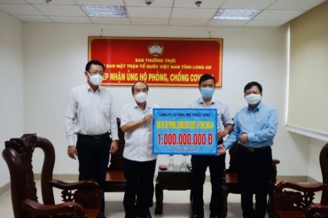 img phuoc dong joint stock company contributes 1 billion vnd to the covid 19 prevention and control fund of long an province